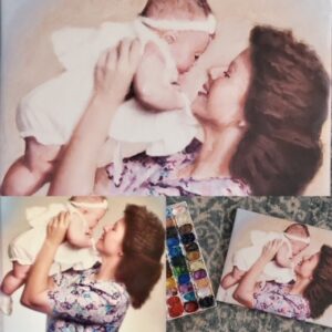 Portrait of a mother holding up her baby girl